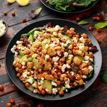 Harissa roasted cauliflower salad with chickpea, cucumber, greens and feta cheese