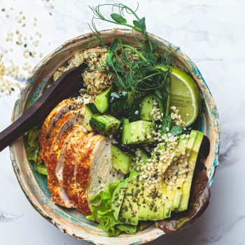 Quinoa salad with grilled chicken breast, avocado and cucumber
